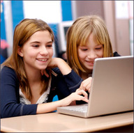 Two students working on a computer